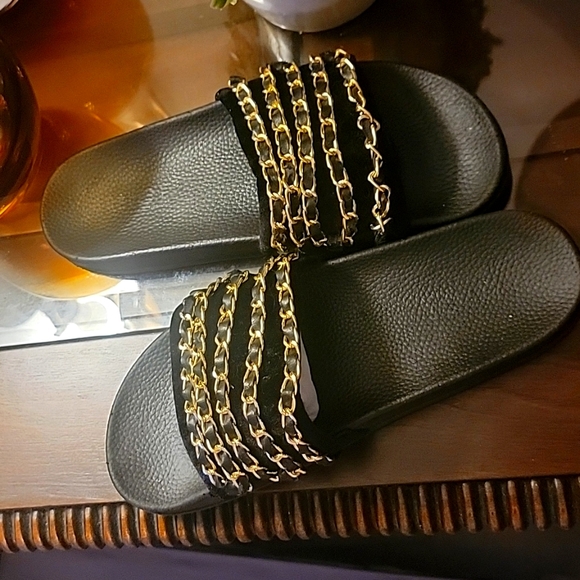 Black slides with gold chains across the top. Size 9 - Picture 3 of 7